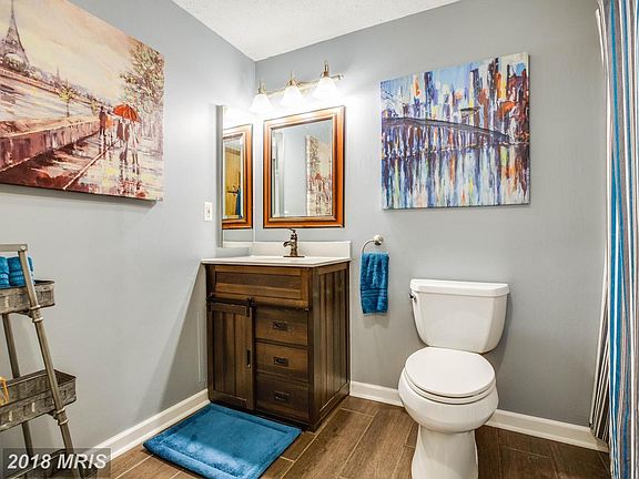 Upper Bathroom w/New flooring and Fixtures