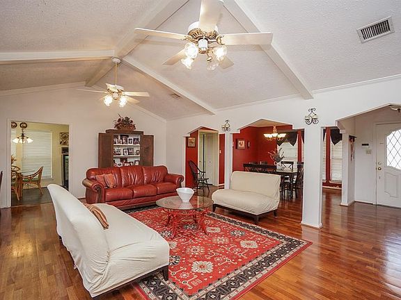 Wonderful high ceiling with multiple beams give this family room an open feel. Formal dining room in the rear will make for great entertaining flow.