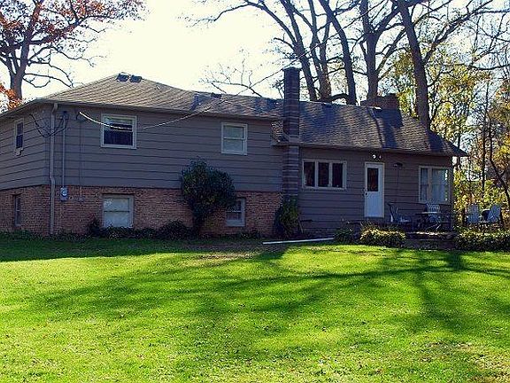 The back of the property now with a new deck. (not pictured here).