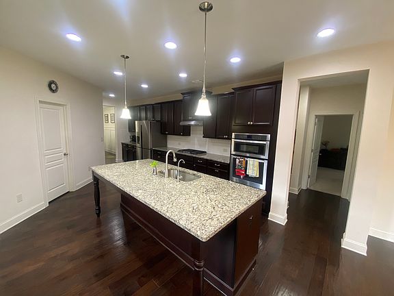 Kitchen with walk in pantry and also has an extra pantry