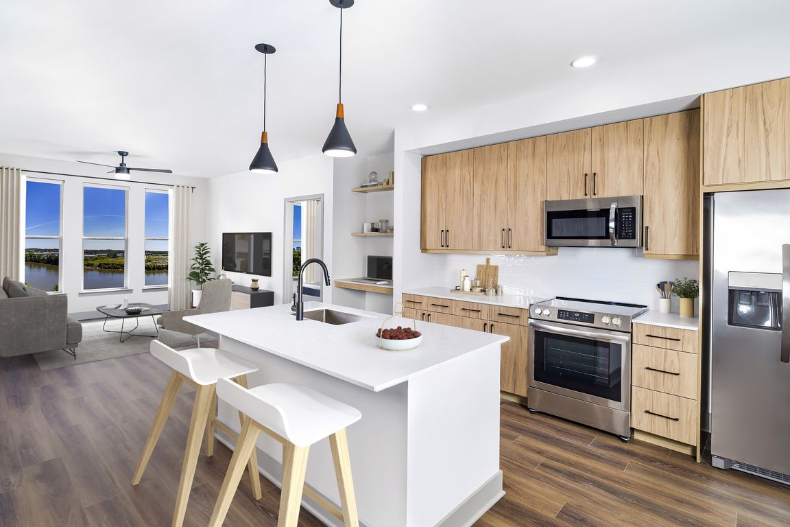 Luxuriate in unparalleled elegance at Modera Riverview with single-basin sinks, stylish tile backsplash, and ENERGY STAR_ stainless steel appliances.
