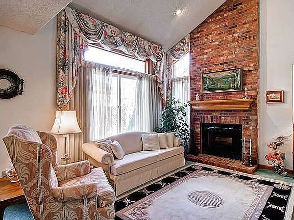 Spacious Family Room with Fireplace and Vaulted Ceilings