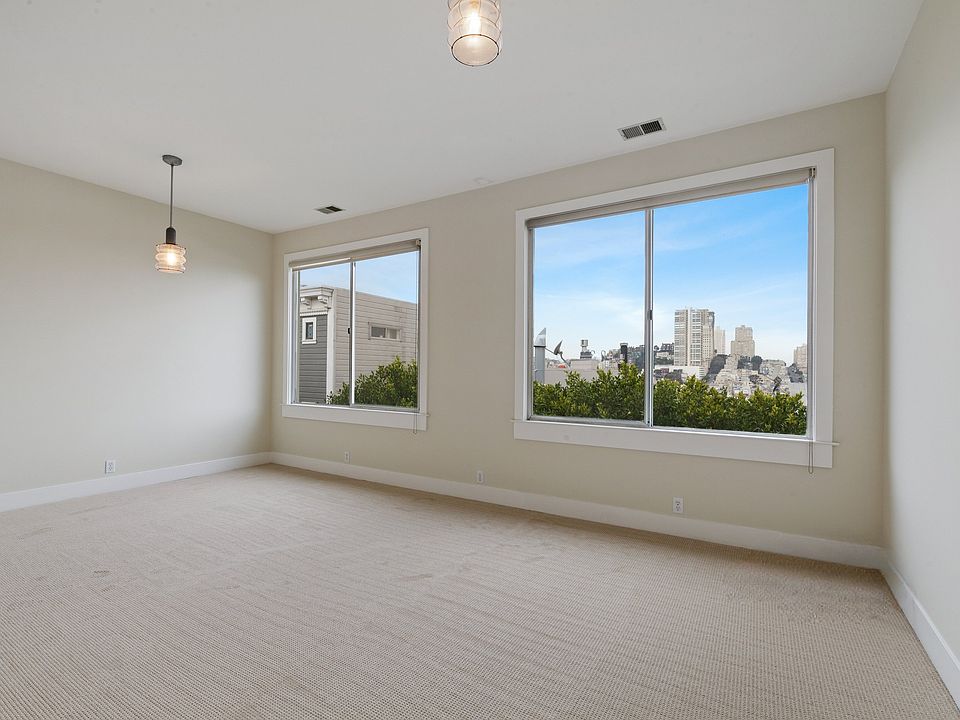 Living Room with Sweeping Views of Russian Hill and SF Bay.