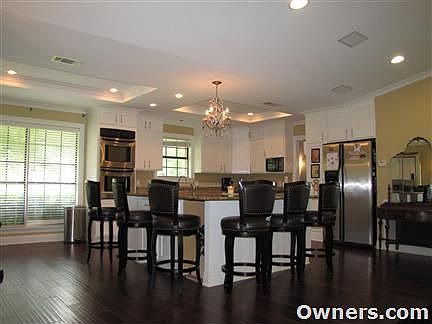 Double sized kitchen island and wood floors
