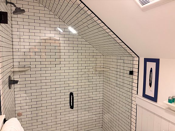 The step-in shower is spacious and modern