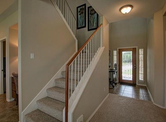 Staircase, looking back toward entryway from formal living area