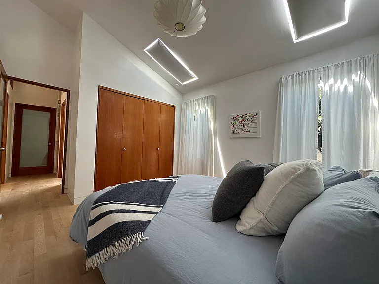 Large guest bedroom, queen size bed (new), skylights, built in closet