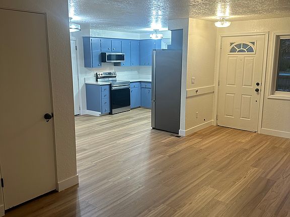 View of the Kitchen from the back of the living room.