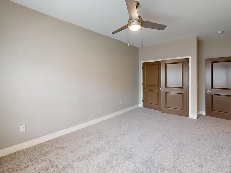 The Kraft floor plan's second bedroom includes a large double door closet. The Kraft floor plan's second bedroom includes a large double door closet.
