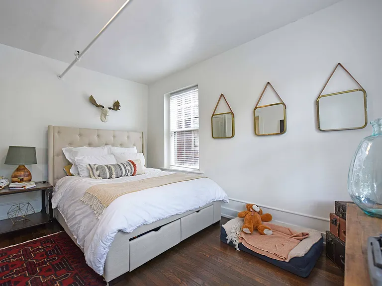 Bedroom with hardwood-style flooring