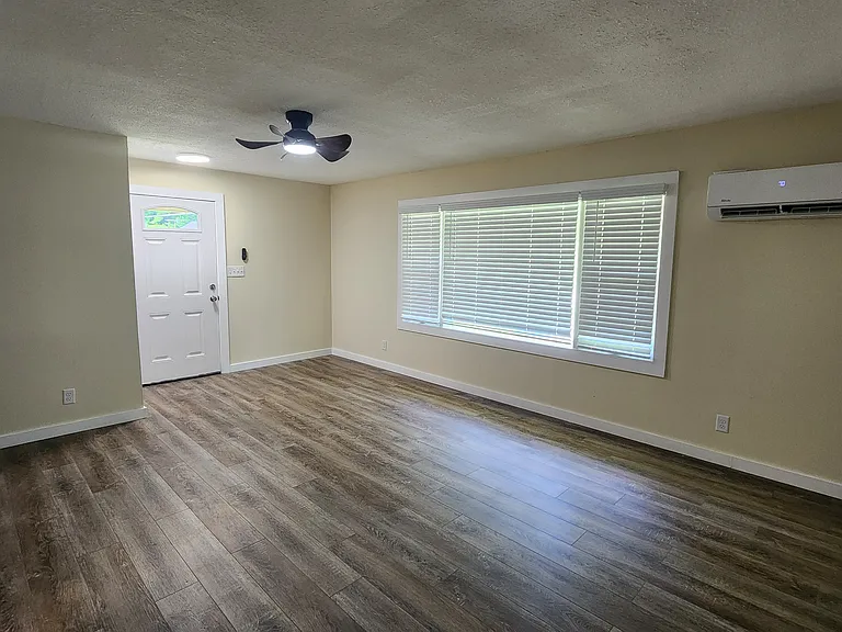 view from back of living room to front door.