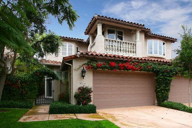 Flowers Surround The Entrance To Your New Home