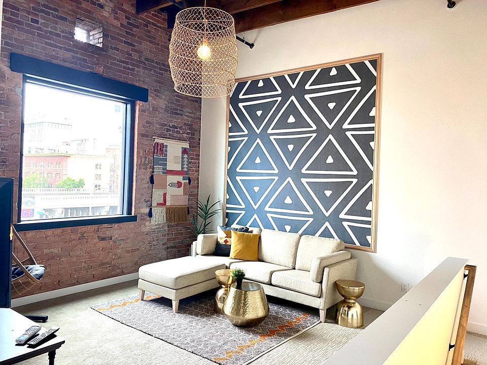 All rooms feature exposed brick walls