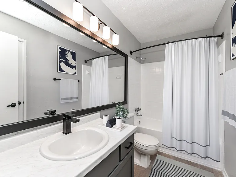 Bathroom with upgraded fixtures, lighting and hardware