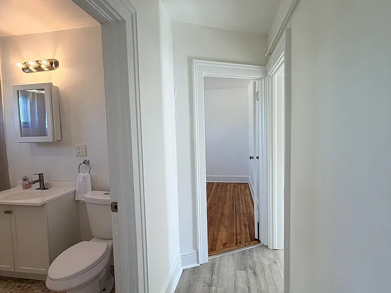 Hallway from third bedroom left of bathroom
