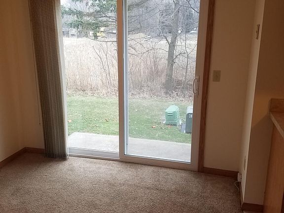 Dining area with slider to concrete patio