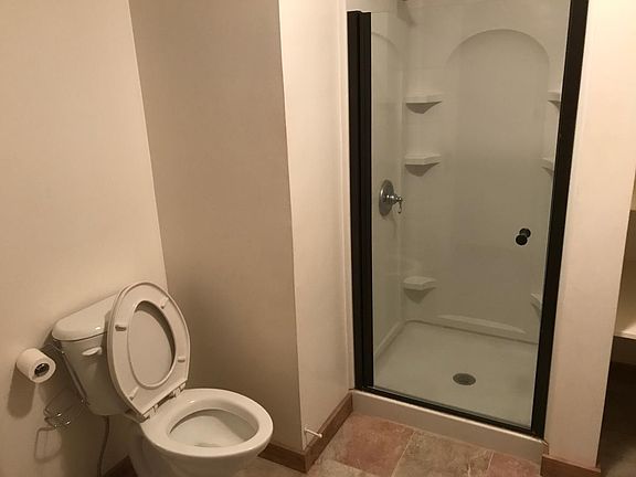 Bathroom has been updated and has a lot of space.