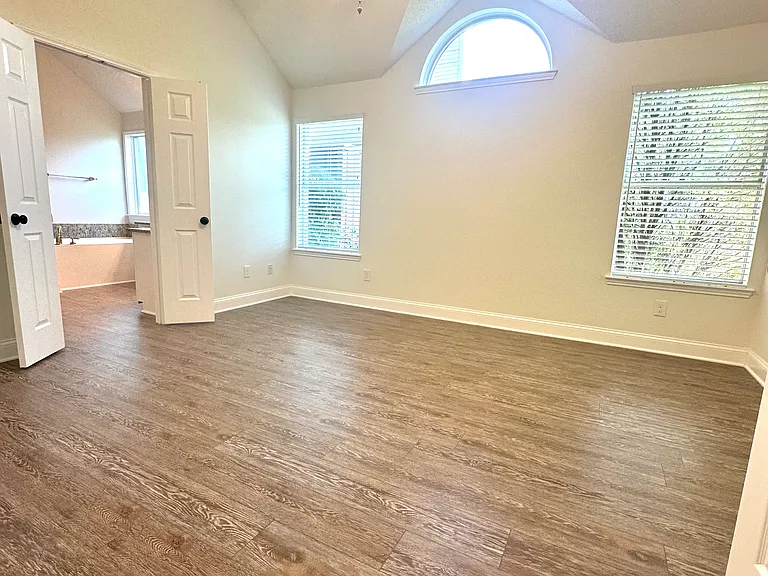 Master bedroom with two windows to side yard with optimum level of privacy and quietness.