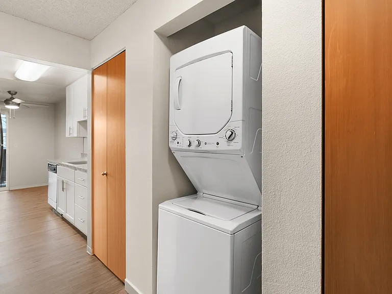 Experience the convenience of a stylish in-unit laundry next to a sleek kitchen. Experience the convenience of a stylish in-unit laundry next to a sleek kitchen.