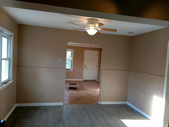 Dining room looking into Living room and front entrance.