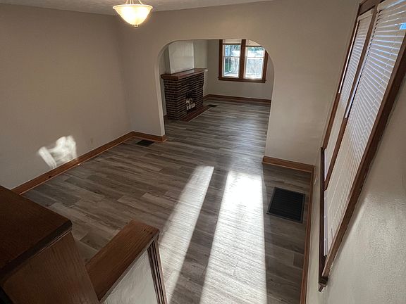 Welcome to a bright and inviting open-concept living and dining area, featuring beautiful new hardwood flooring throughout. The spacious layout creates an easy flow between the living and dining areas.