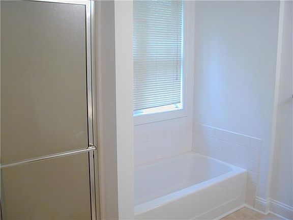 Master bath has both soaking tub & separate shower