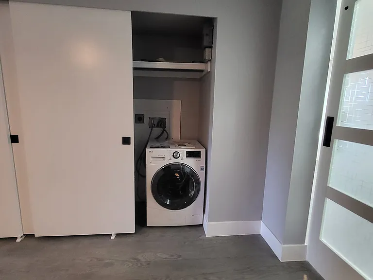 Washer dryer combo in master bedroom