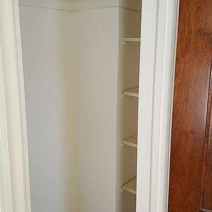 Her closet has side shelves 