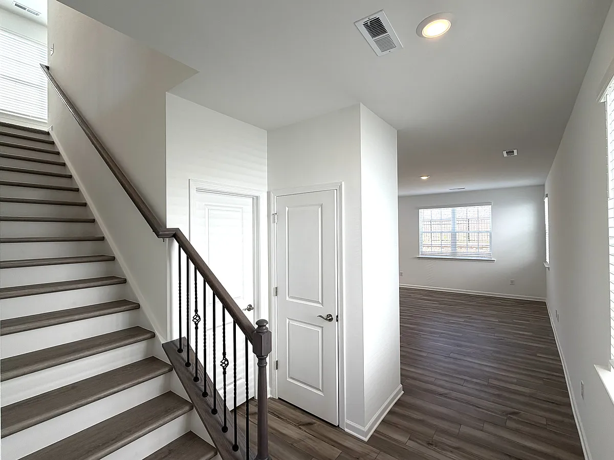 entry to this brand new home! The first floor half bath is the first door on the left. - 5259 Amaryllis Way