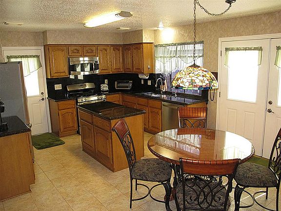 Updated back door with enclosed blinds.