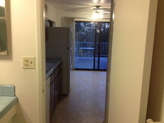 Part of bathroom looking through kitchen dinette area onto p