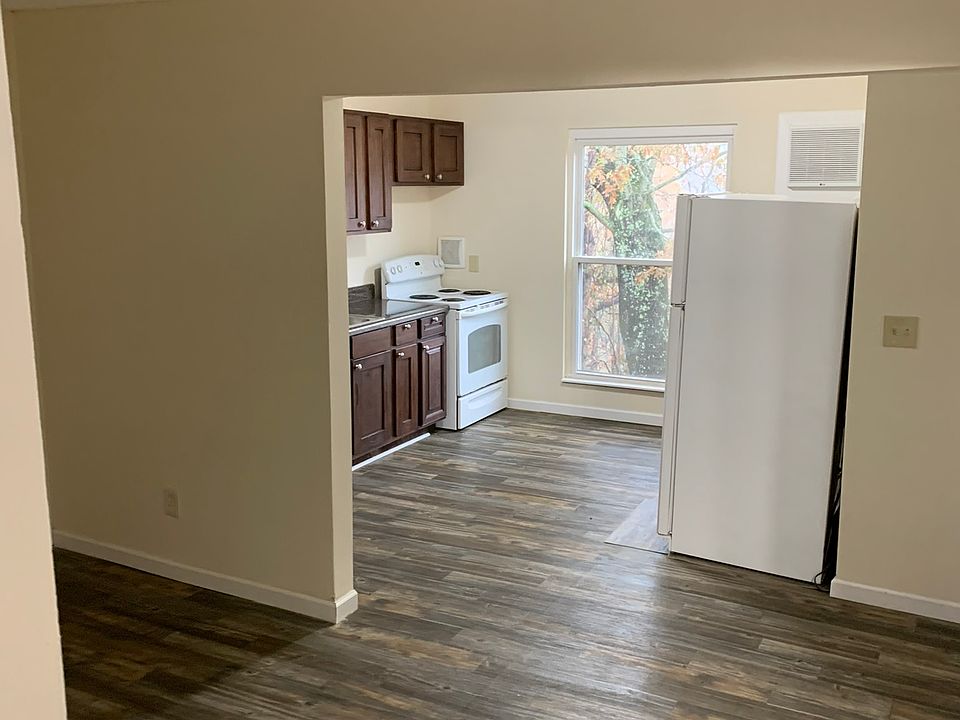 From entry steps, looking towards the kitchen, living room on the left.