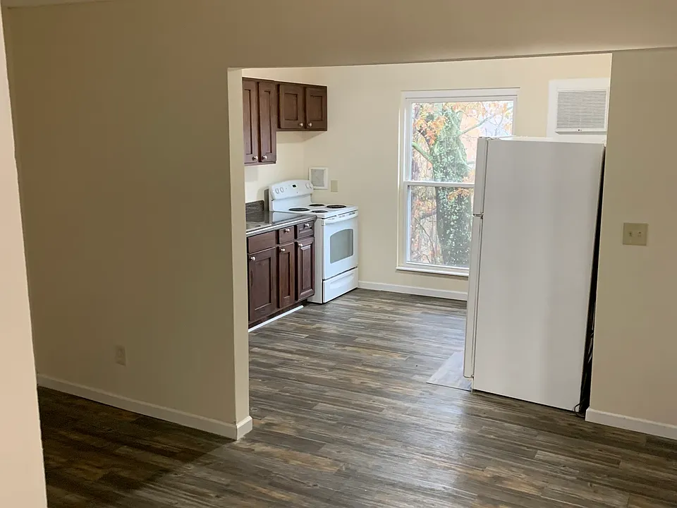 From entry steps, looking towards the kitchen, living room on the left.