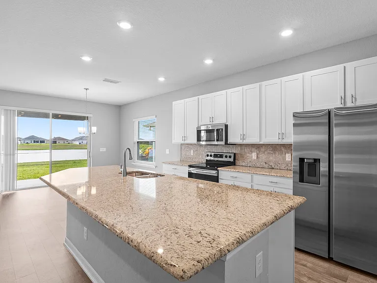 extra large kitchen isle with quartz counter top