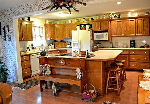 Country Kitchen with lots of custom cabinets