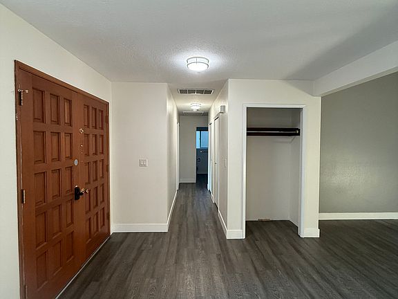 Entryway - hallway leads to the bedrooms and the bathrooms.