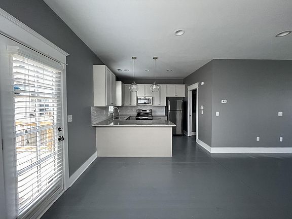 Room for barstools as well as a nice farmhouse dining table.