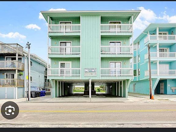Entrance is driveway to the right of the building - between building and power pole- coffee shop/breakfast/connivence mart across street