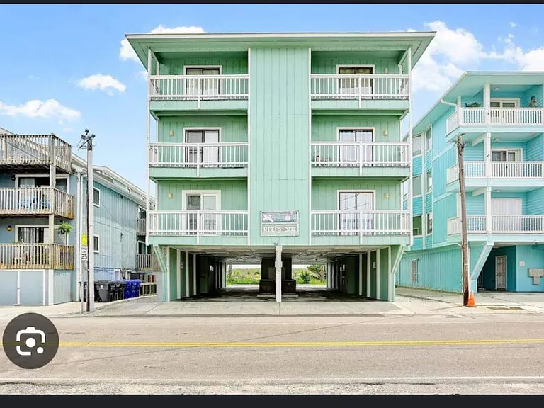 Entrance is driveway to the right of the building - between building and power pole- coffee shop/breakfast/connivence mart across street
