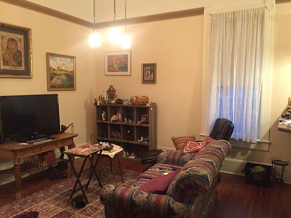 Living Room. Pictured with current tenant_s furniture and wall coverings.
