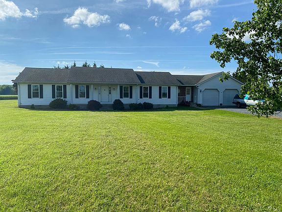 Front view rancher on 4 country acres. (All new windows)