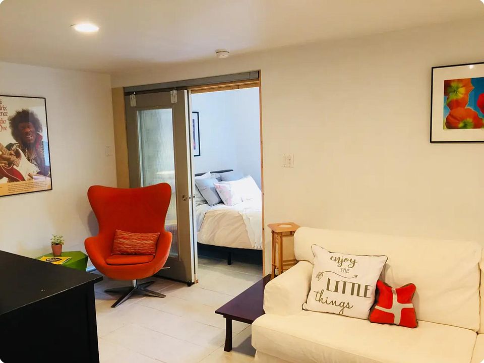 Main salon from kitchen with view of front bedroom/office.