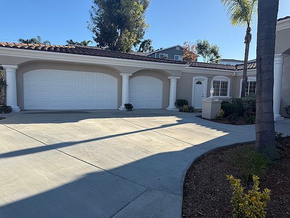 3 Car Garage Finished Inside with Epoxy Flooring and Cabinets for Storage