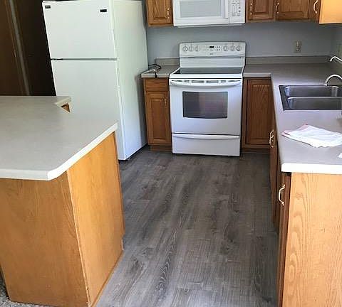 Kitchen appliances, large island with storage.
