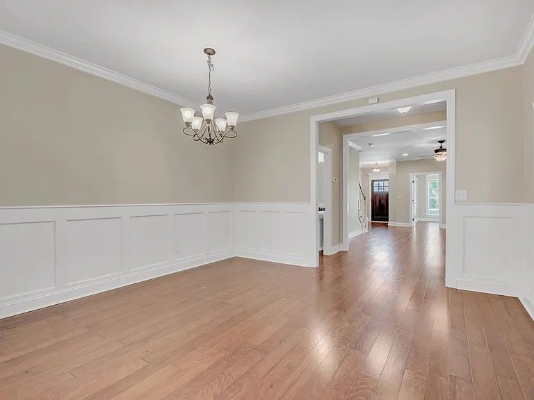 Open concept dining room flows between kitchen and living room
