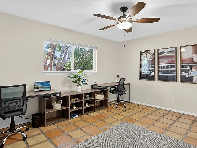 Dedicated office space for two
+Additional screen 
+Ergonomic chairs
+Ceiling fan