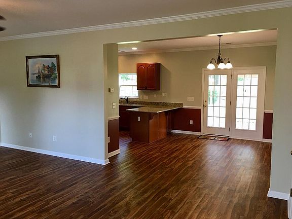 Open concept living with new floors, kitchen and paint