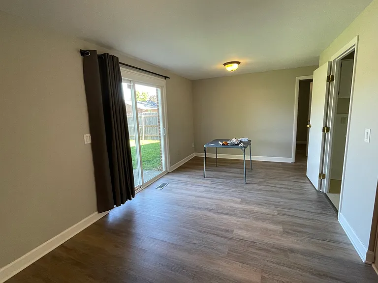 dining room, patio door to fenced backyard.