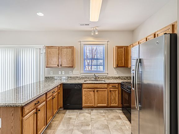 Window at sink. Sliding door to backyard.