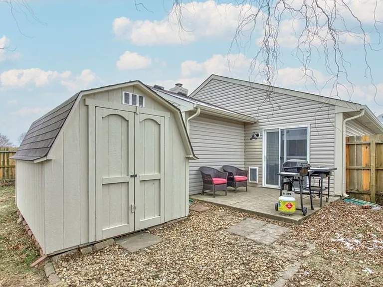 Backyard storage shed providing extra space for tools and equipment.